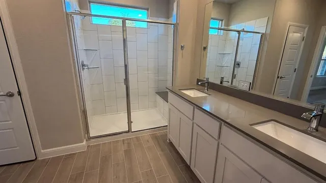 a view of kitchen with refrigerator and wooden floor