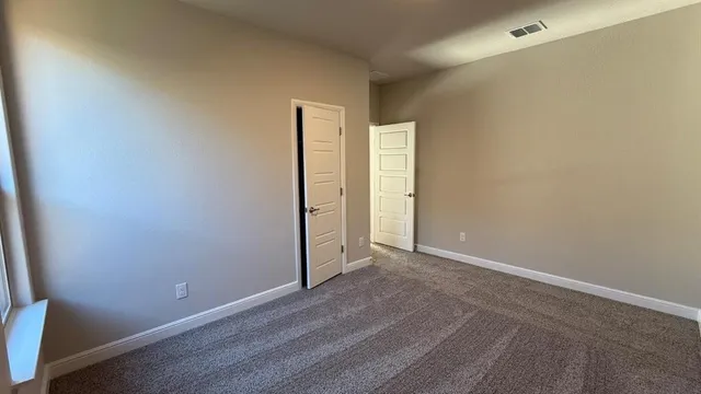 a bathroom with a double vanity sink and mirror