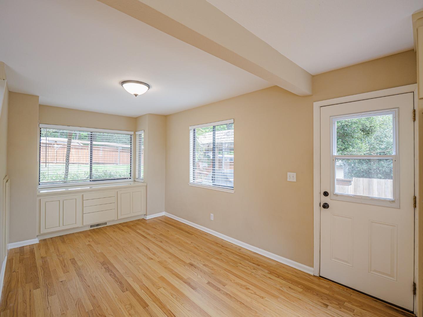 3040 Pacific Heights Drive Aptos, CA 95003 - Photo 19 of 55 a view of empty room with wooden floor and fan