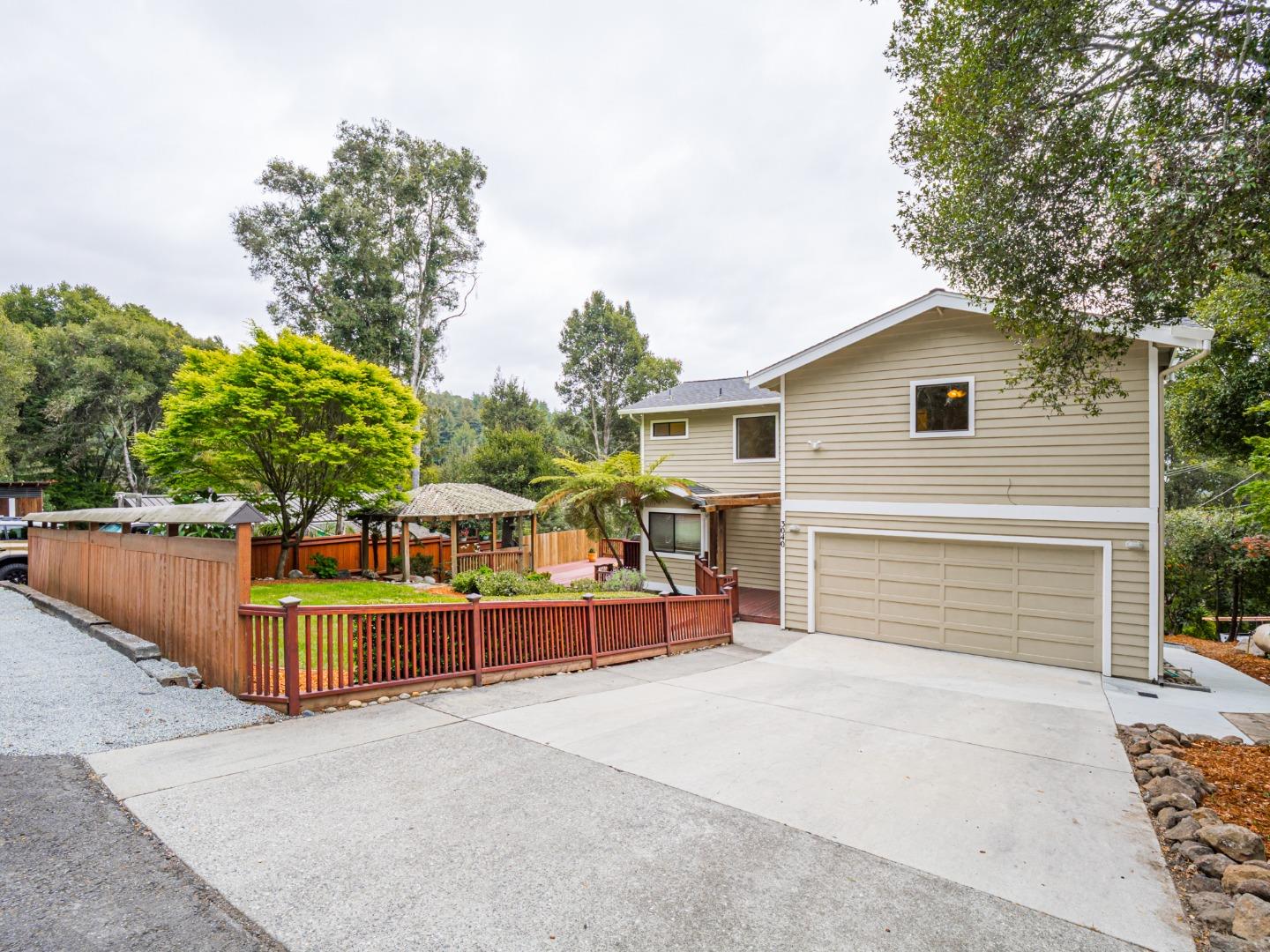 3040 Pacific Heights Drive Aptos, CA 95003 - Photo 37 of 55 a view of a house with a yard