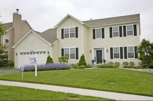 2280 Trailside Lane Wauconda, IL 60084 - Photo 1 of 1 a front view of house with yard and green space