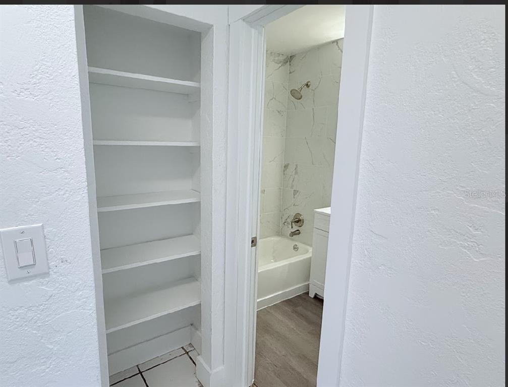 2270 Aaron Street, Unit B Port Charlotte, FL 33952 - Photo 9 of 12 a bathroom with a sink and a shower