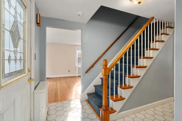 a view of an entryway with wooden floor