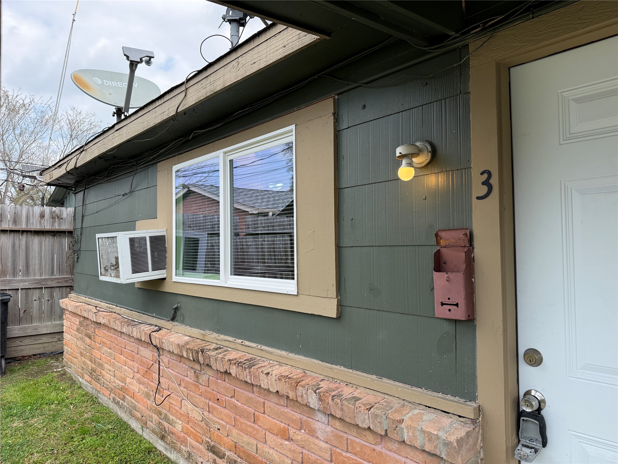 8010 Roswell Street, Unit 3 Houston, TX 77022 - Photo 11 of 12 a front view of a house with a yard
