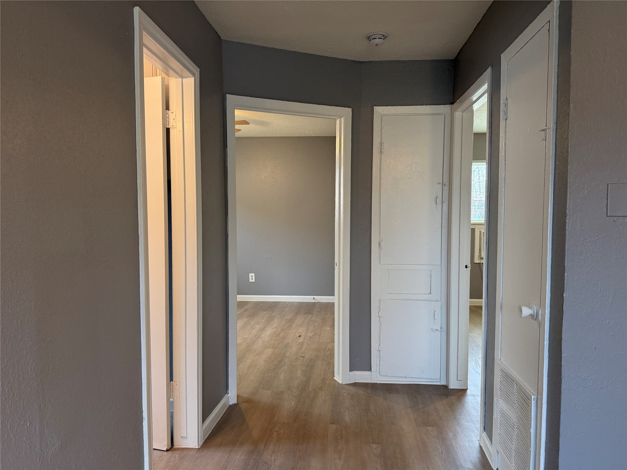 8010 Roswell Street, Unit 3 Houston, TX 77022 - Photo 7 of 12 a view of a hallway with wooden floor