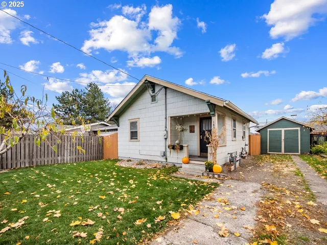 a front view of a house with outdoor seating