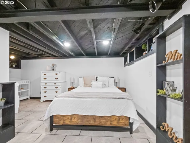 a spacious bedroom with a bed in it