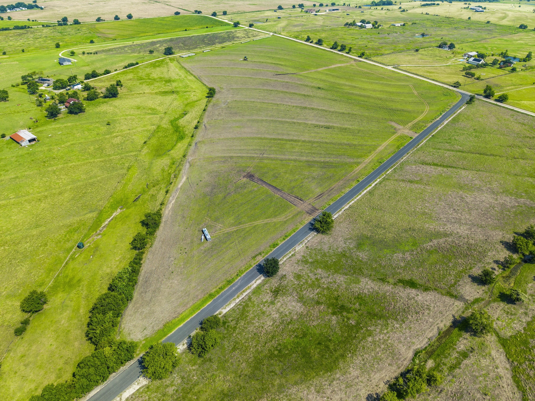 1 County Road 327 Road Granger, TX 76530 - Photo 9 of 27 Vast green pastures and rolling acreage offer endless possibilities under wide open skies.