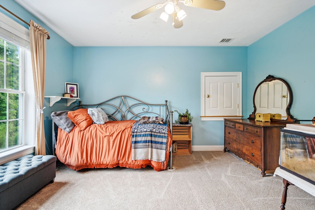 5 Maple Street Pepperell, MA 01463 - Photo 20 of 39 a bedroom with a bed and a dresser