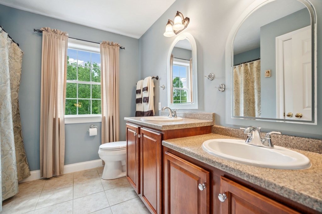5 Maple Street Pepperell, MA 01463 - Photo 23 of 39 a bathroom with a granite countertop sink and a mirror