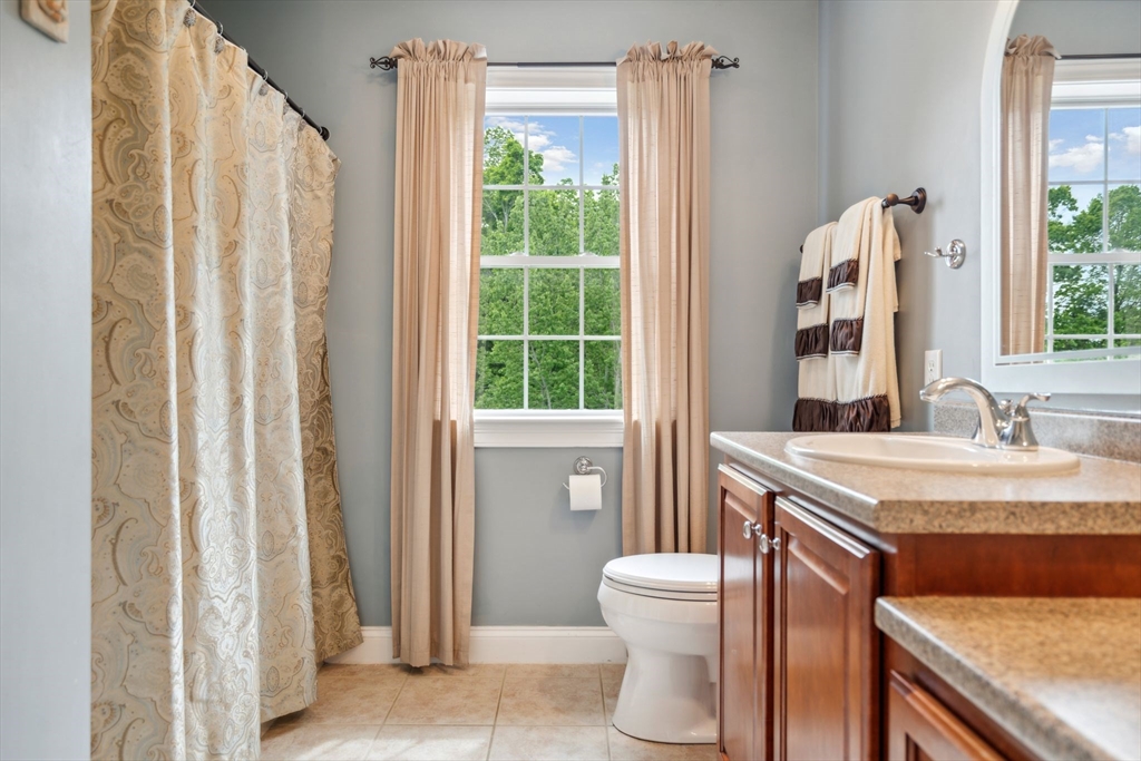 5 Maple Street Pepperell, MA 01463 - Photo 24 of 39 a bathroom with a granite countertop sink and a mirror