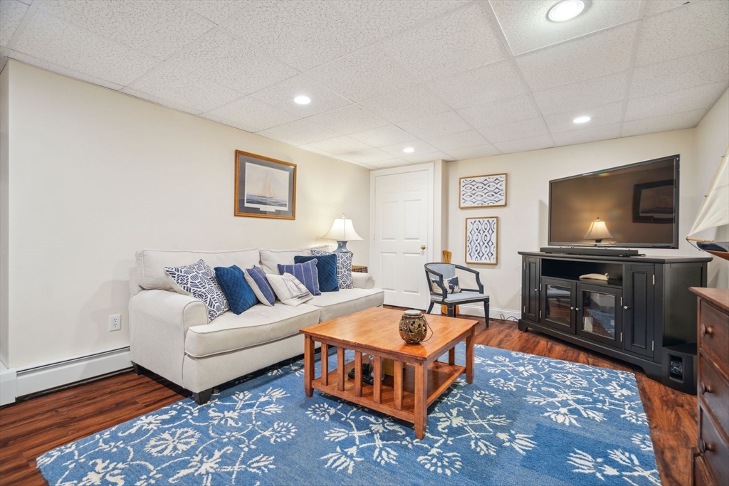 5 Maple Street Pepperell, MA 01463 - Photo 31 of 39 a living room with furniture and a flat screen tv