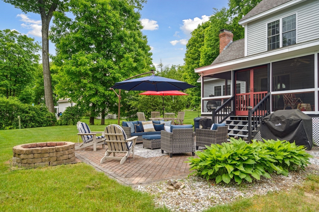 5 Maple Street Pepperell, MA 01463 - Photo 37 of 39 a view of backyard with outdoor seating and green space
