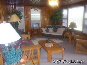N John Shehan Road Tryon, NC 28782 - Photo 5 of 9 a living room with furniture and a lamp