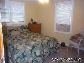 N John Shehan Road Tryon, NC 28782 - Photo 9 of 9 a bed sitting in a bedroom next to a window