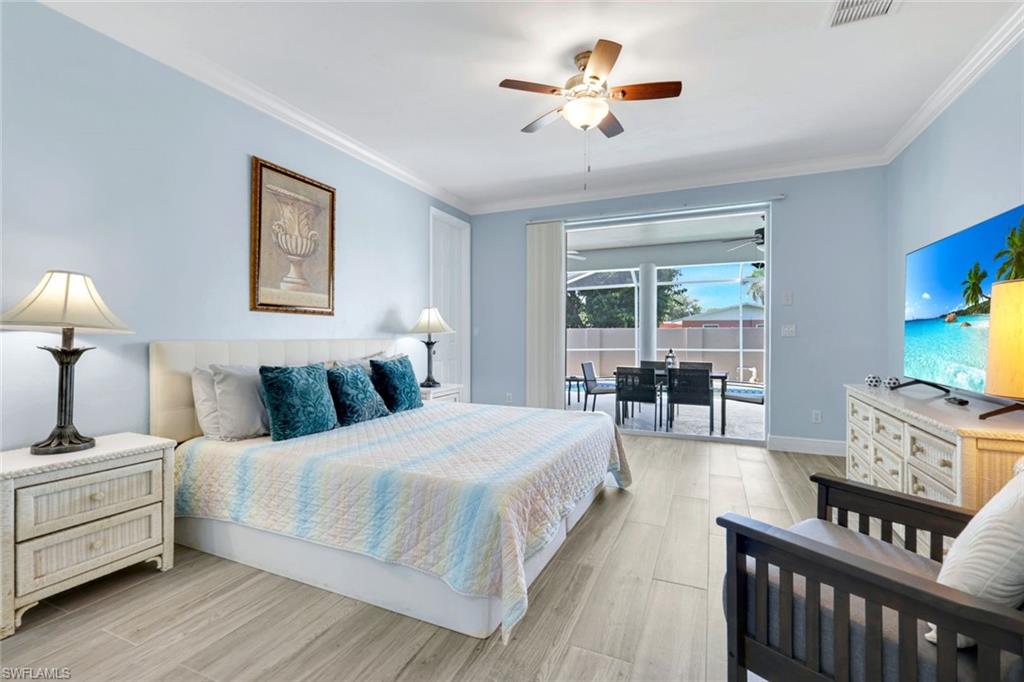 746 101st Avenue North Naples, FL 34108 - Photo 13 of 33 a bedroom with a bed a couch and dresser