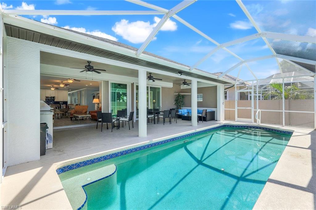 746 101st Avenue North Naples, FL 34108 - Photo 24 of 33 a view of a patio with table and chairs