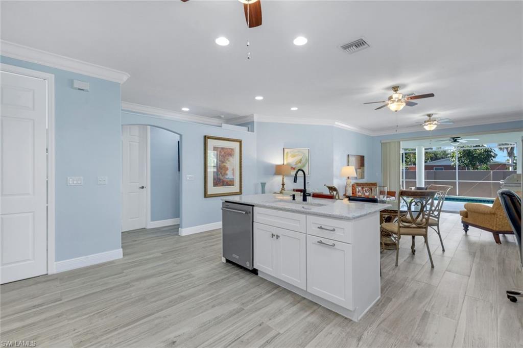 746 101st Avenue North Naples, FL 34108 - Photo 5 of 33 a view of living room kitchen island and furniture