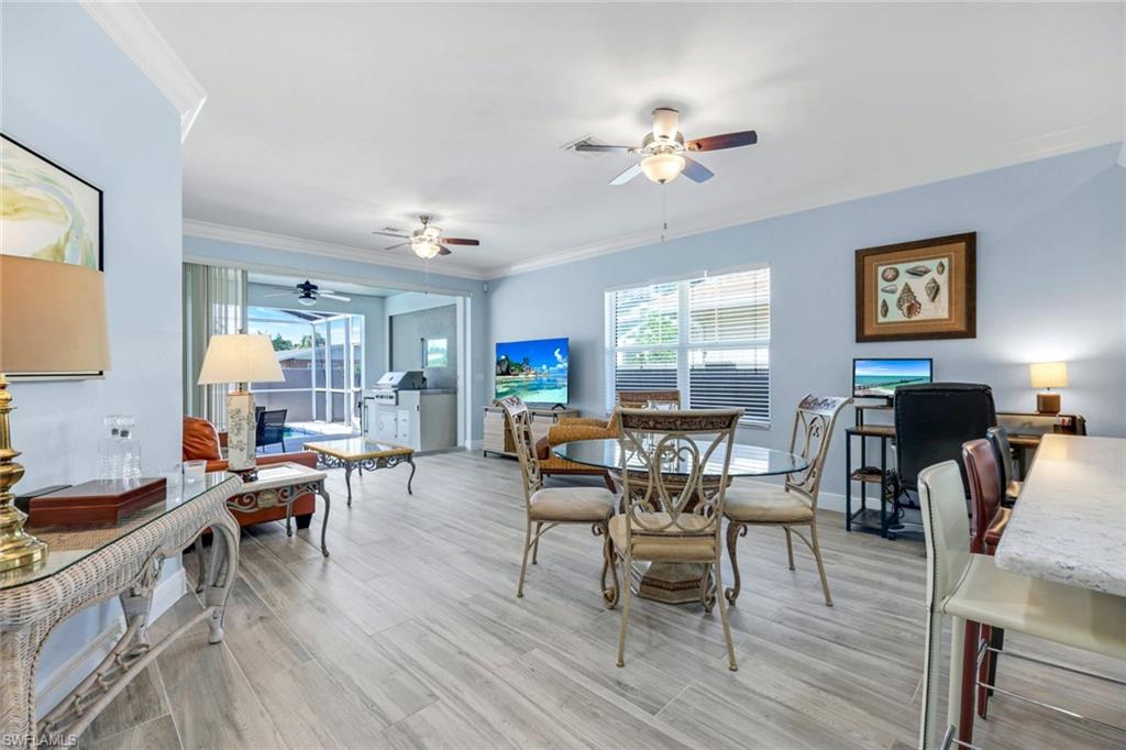 746 101st Avenue North Naples, FL 34108 - Photo 9 of 33 a living room with furniture and a wooden floor