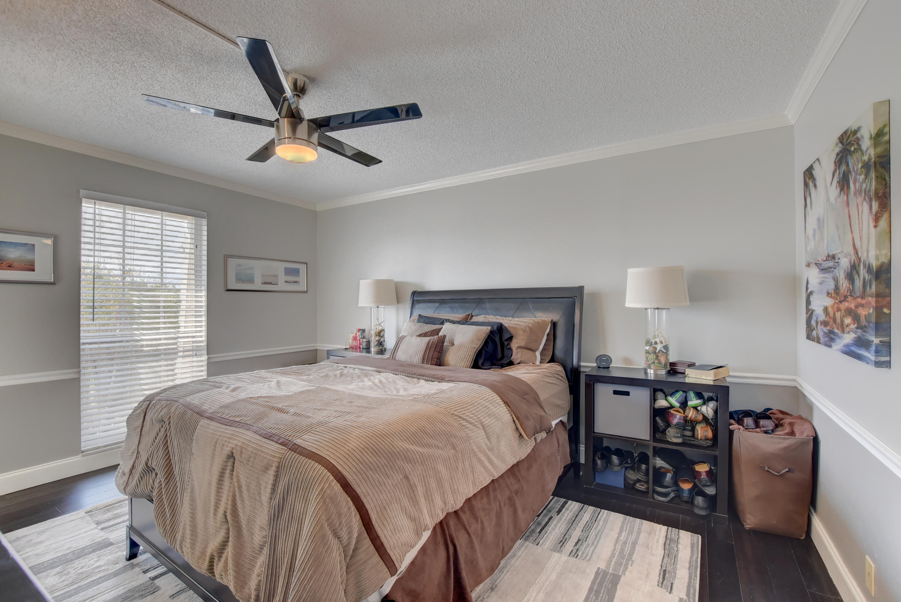 765 Jeffery Street, Unit 1306 Boca Raton, FL 33487 - Photo 20 of 34 a bedroom with a bed and wooden floor