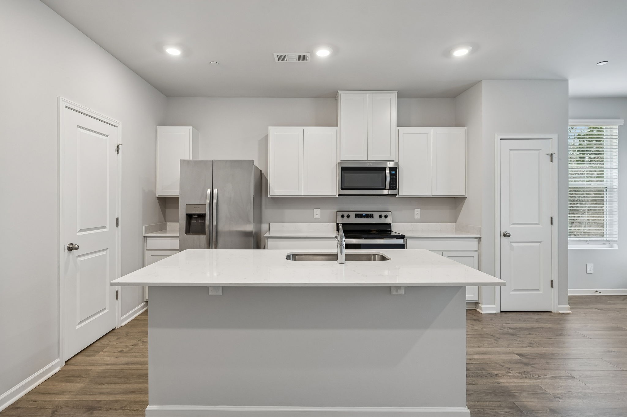 174 Mackenzie Way Lewisburg, TN 37091 - Photo 15 of 33 a kitchen with stainless steel appliances a refrigerator sink and microwave