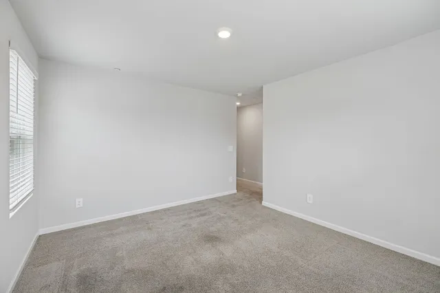 an empty room with a empty space and window