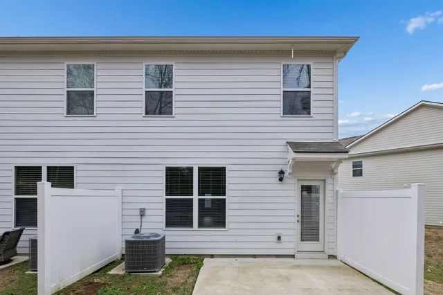a view of house with yard