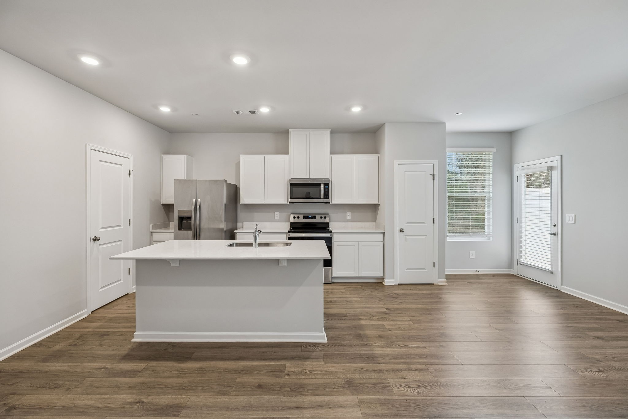 174 Mackenzie Way Lewisburg, TN 37091 - Photo 8 of 33 a view of kitchen with stainless steel appliances granite countertop a stove top oven a sink and a refrigerator