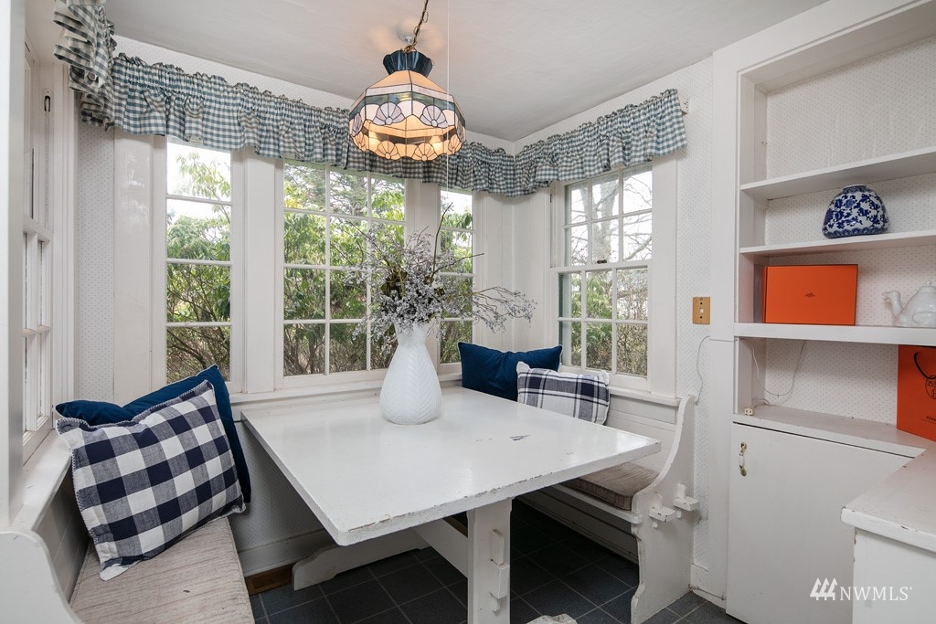 5435 Sand Road Bellingham, WA 98226 - Photo 26 of 38 a view of a dining room with furniture a chandelier and wooden floor