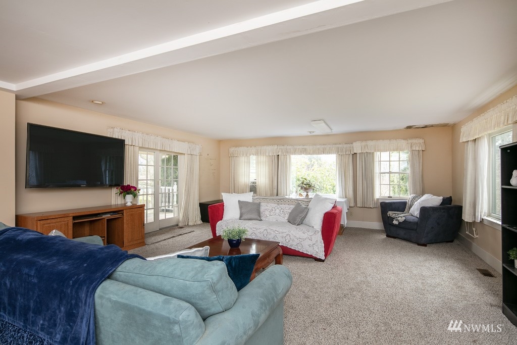 5435 Sand Road Bellingham, WA 98226 - Photo 30 of 38 a living room with furniture and a flat screen tv