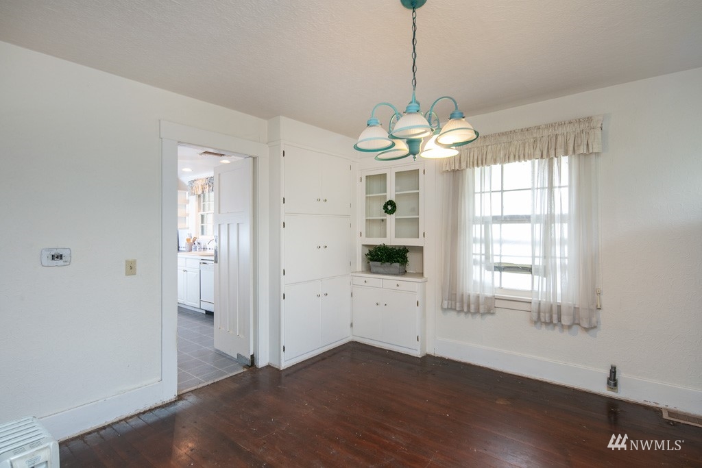 5435 Sand Road Bellingham, WA 98226 - Photo 32 of 38 a view of an empty room with wooden floor and a window