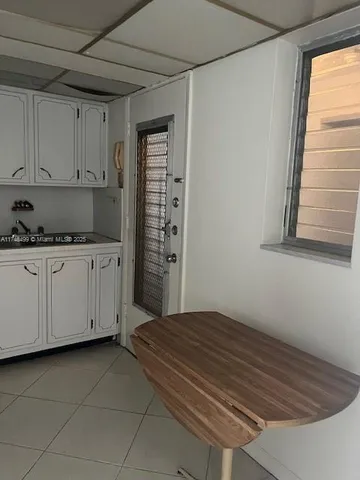 a bedroom with a bed and cabinets