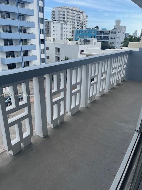 1662 Lincoln Court, Unit 508 Miami Beach, FL 33139 - Photo 9 of 20 a view of a balcony with a floor to ceiling window and stairs