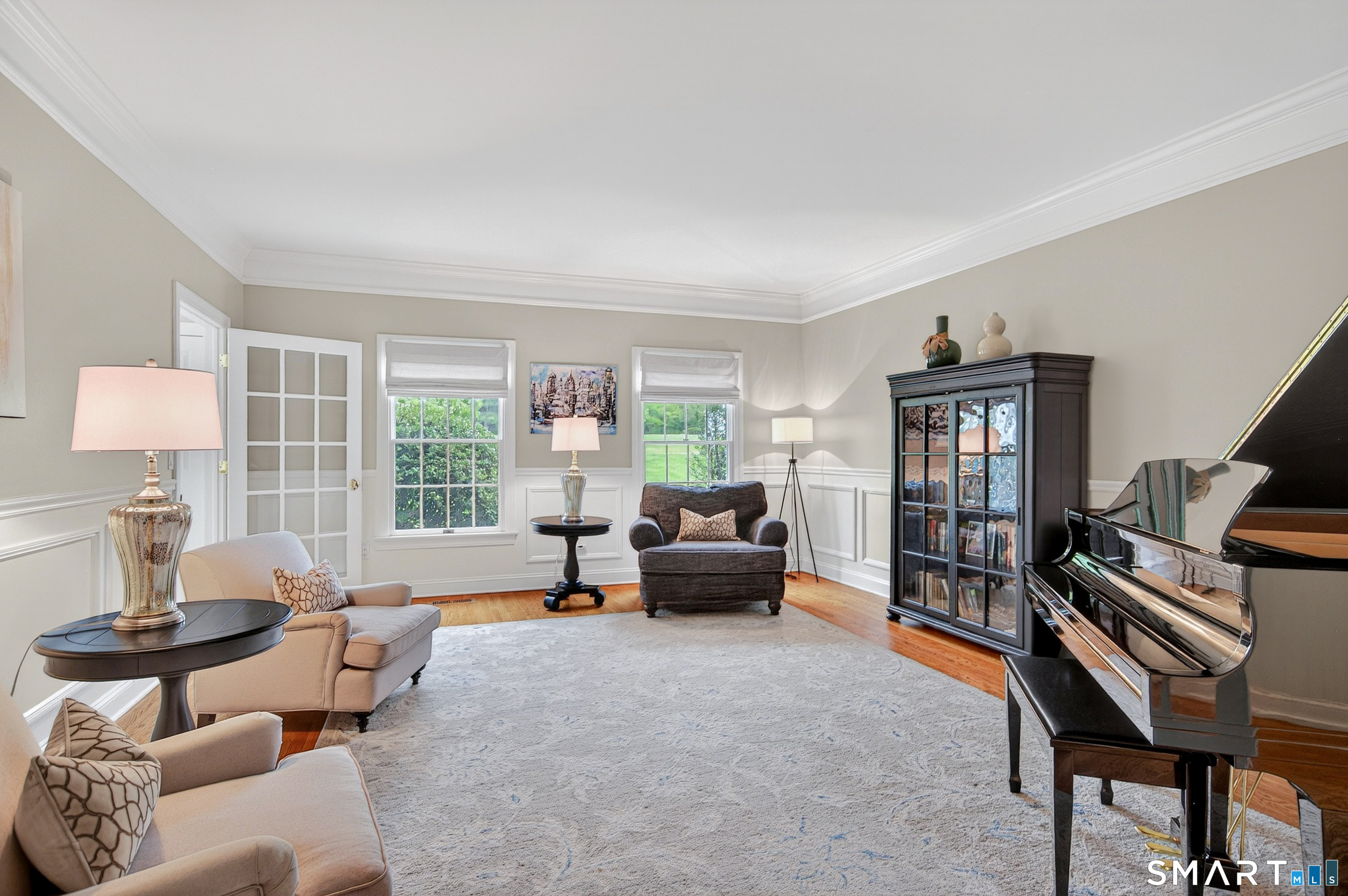16 Farm Meadow Road Newtown, CT 06470 - Photo 13 of 40 Elegant formal living room featuring hardwood floors, detailed molding, and a sophisticated entertaining space.