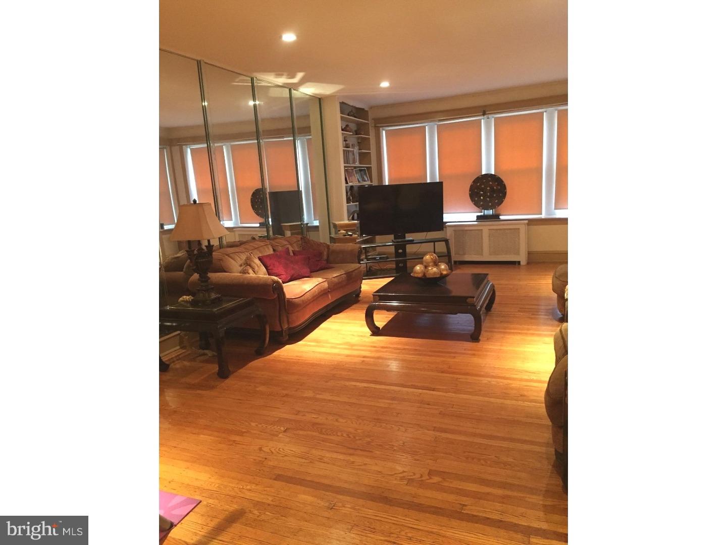 525 Holly Road Yeadon, PA 19050 - Photo 2 of 25 a living room with furniture and large windows