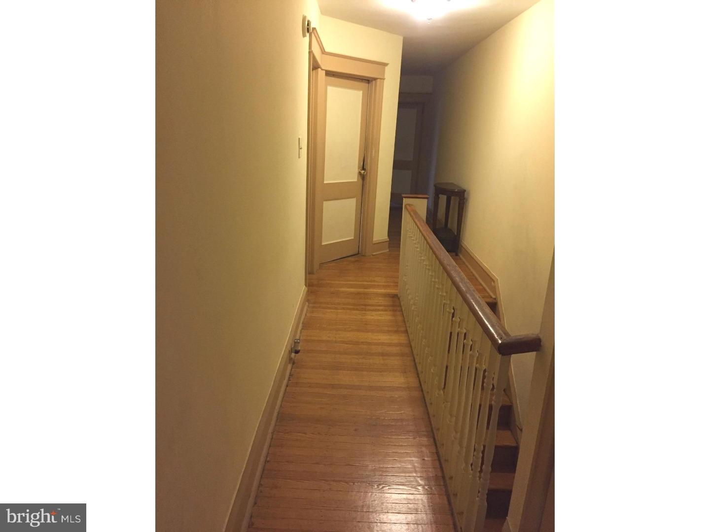 525 Holly Road Yeadon, PA 19050 - Photo 12 of 25 a view of a hallway with wooden floor