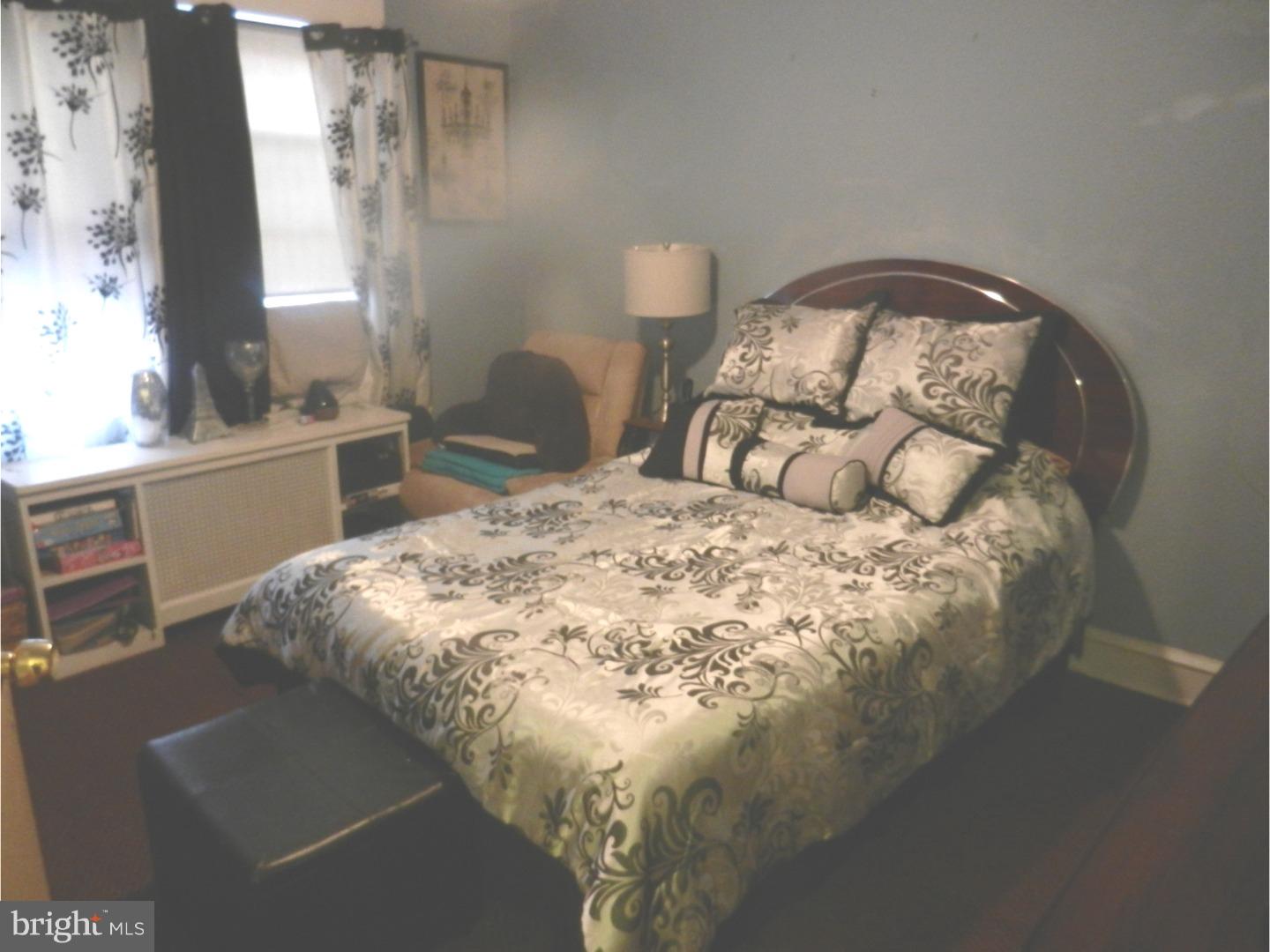 525 Holly Road Yeadon, PA 19050 - Photo 14 of 25 a bedroom with a bed and a window