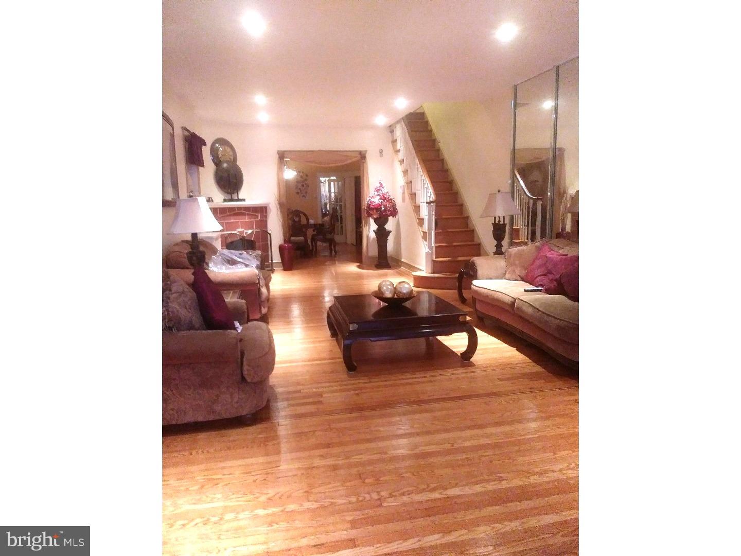 525 Holly Road Yeadon, PA 19050 - Photo 3 of 25 a living room with furniture and a potted plant