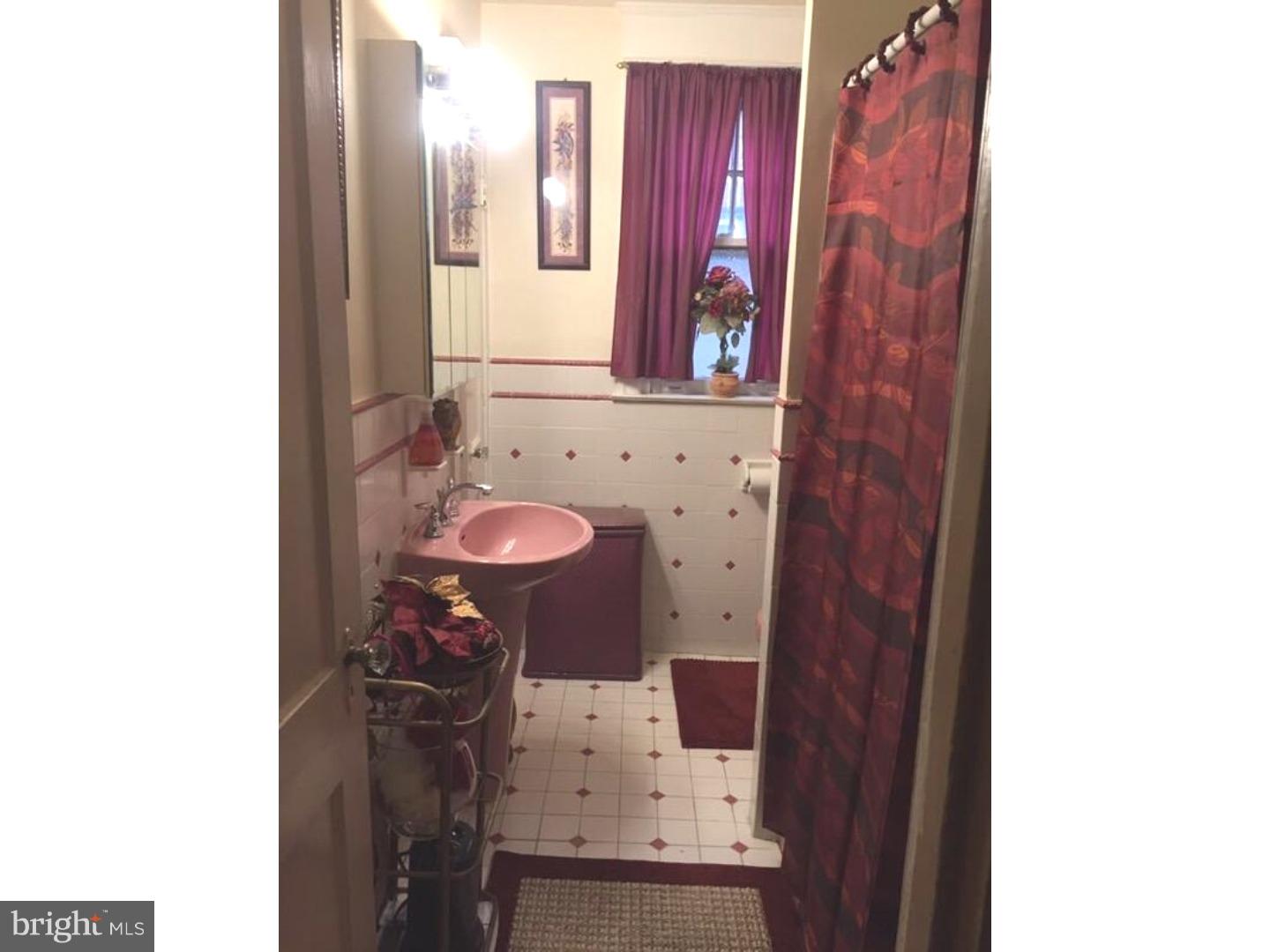 525 Holly Road Yeadon, PA 19050 - Photo 21 of 25 a bathroom with a sink and a mirror