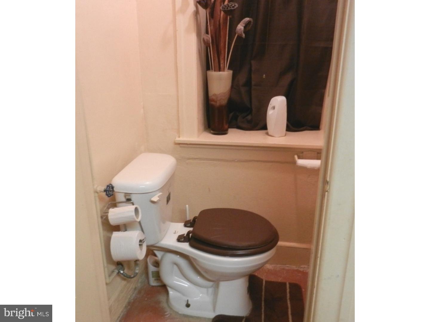 525 Holly Road Yeadon, PA 19050 - Photo 25 of 25 a bathroom with a toilet and a sink