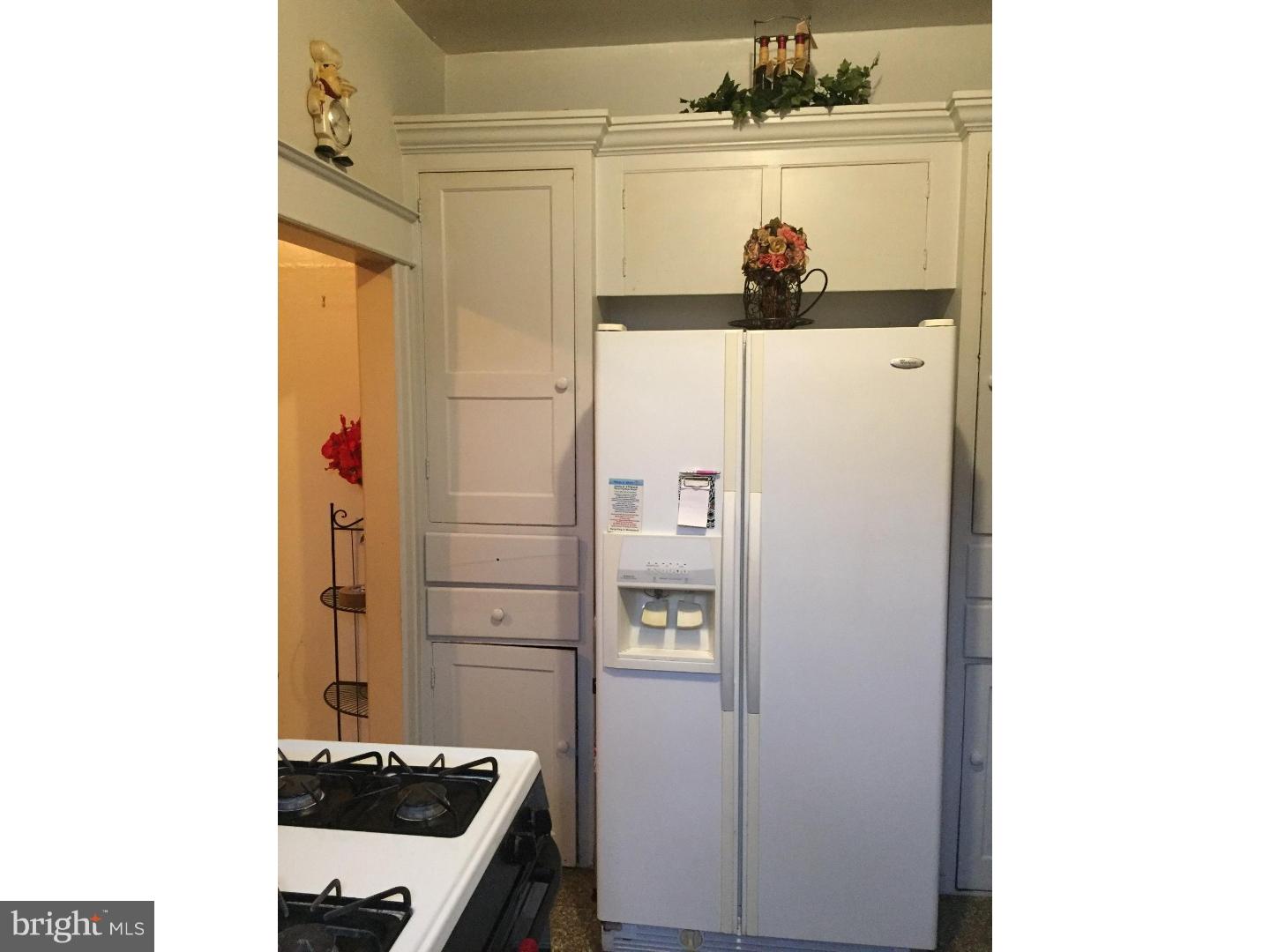 525 Holly Road Yeadon, PA 19050 - Photo 8 of 25 a kitchen with stainless steel appliances a refrigerator and a stove