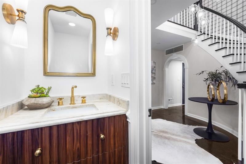 650 Moores Mill Road Northwest, Unit 11 Atlanta, GA 30327 - Photo 14 of 31 a bathroom with a sink and a mirror