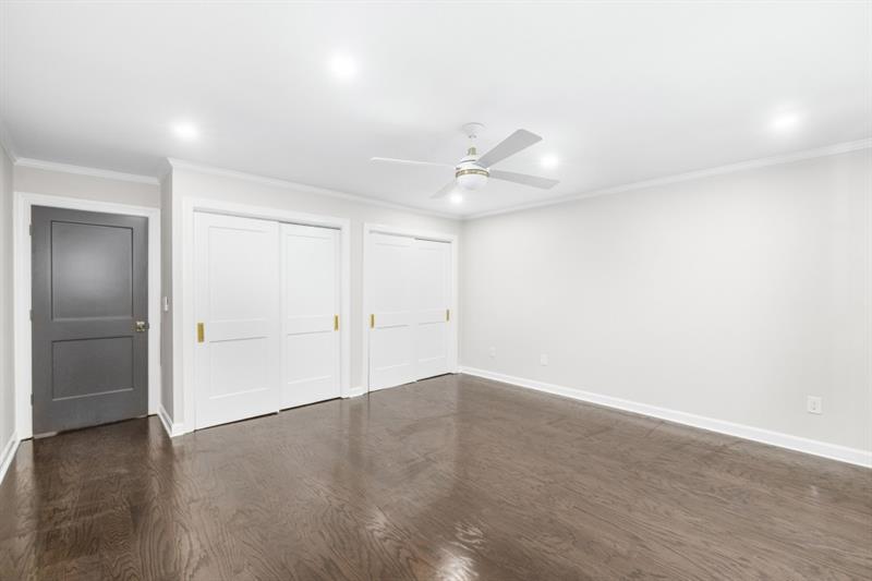 650 Moores Mill Road Northwest, Unit 11 Atlanta, GA 30327 - Photo 27 of 31 wooden floor in an empty room