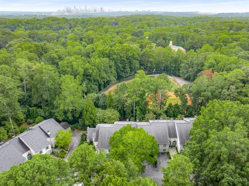 650 Moores Mill Road Northwest, Unit 11 Atlanta, GA 30327 - Photo 30 of 31 an aerial view of a house and yard