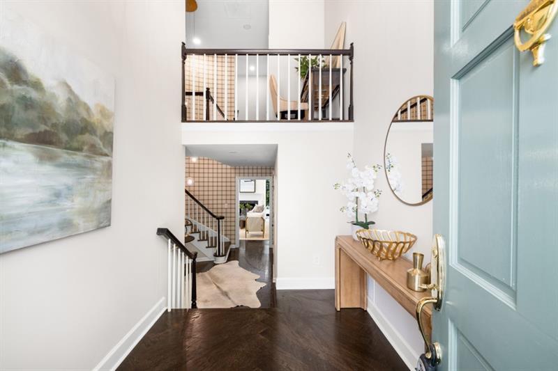 650 Moores Mill Road Northwest, Unit 11 Atlanta, GA 30327 - Photo 3 of 31 a view of a hallway with wooden floor and entryway