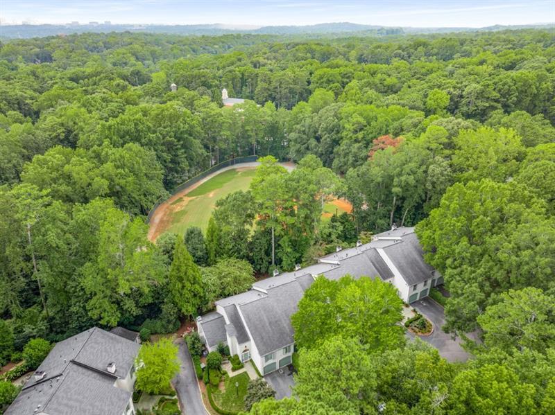 650 Moores Mill Road Northwest, Unit 11 Atlanta, GA 30327 - Photo 31 of 31 an aerial view of a house with a yard