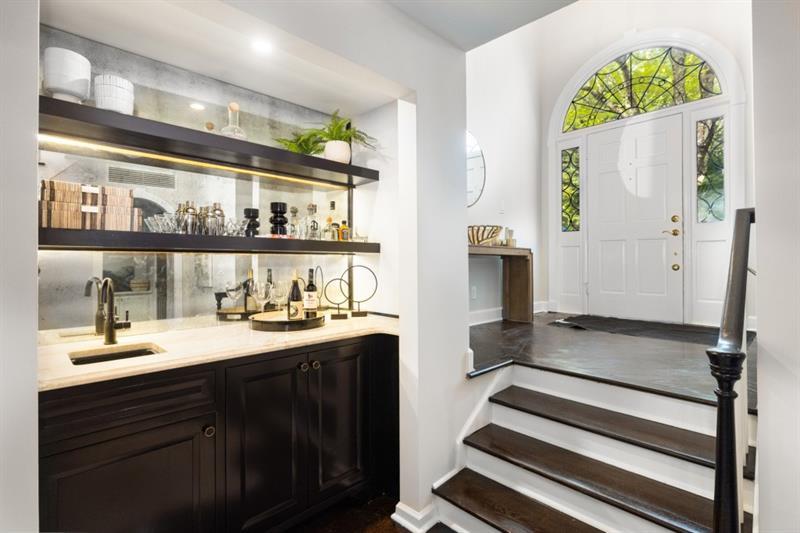 650 Moores Mill Road Northwest, Unit 11 Atlanta, GA 30327 - Photo 5 of 31 a bathroom with a sink and a mirror