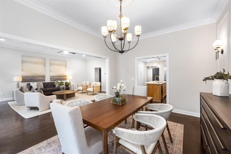 650 Moores Mill Road Northwest, Unit 11 Atlanta, GA 30327 - Photo 9 of 31 a view of a dining room with furniture wooden floor and chandelier