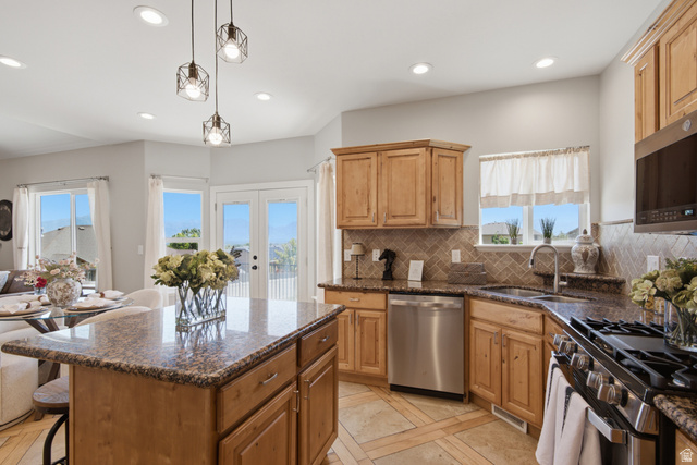 1252 Skyline Road Saratoga Springs, UT 84045 - Photo 16 of 51 Kitchen featuring wood cabinetry, granite countertops, and stainless steel appliances