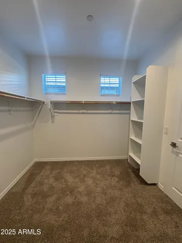 a view of an empty room and a window